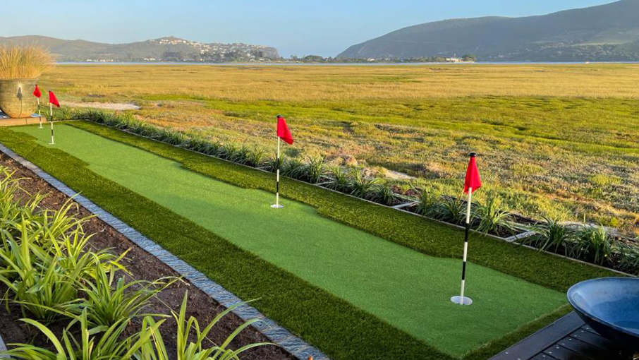 Residential putting green with red flags overlooking the Knysna lagoon